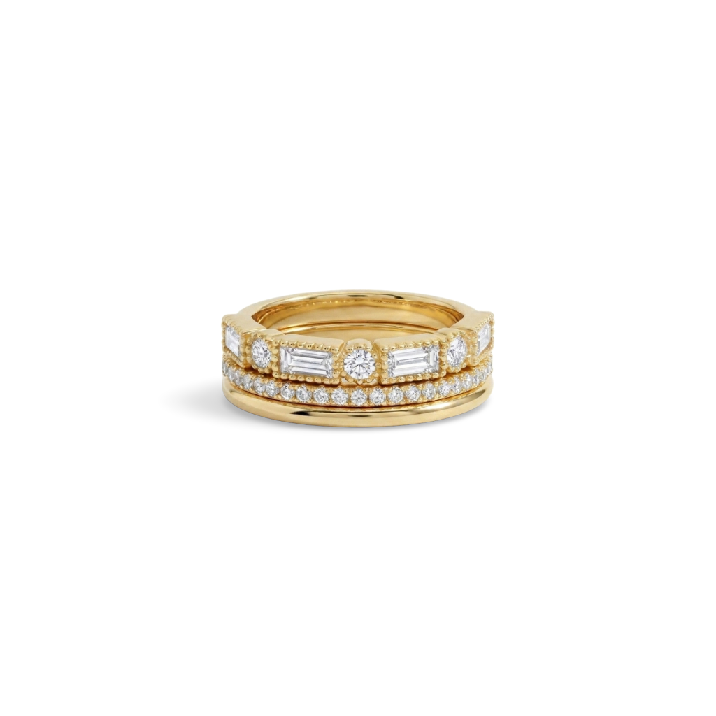 Vintage Ring Stack: three gold stacking rings, including a round and baguette CZ ring, shown together on a white background