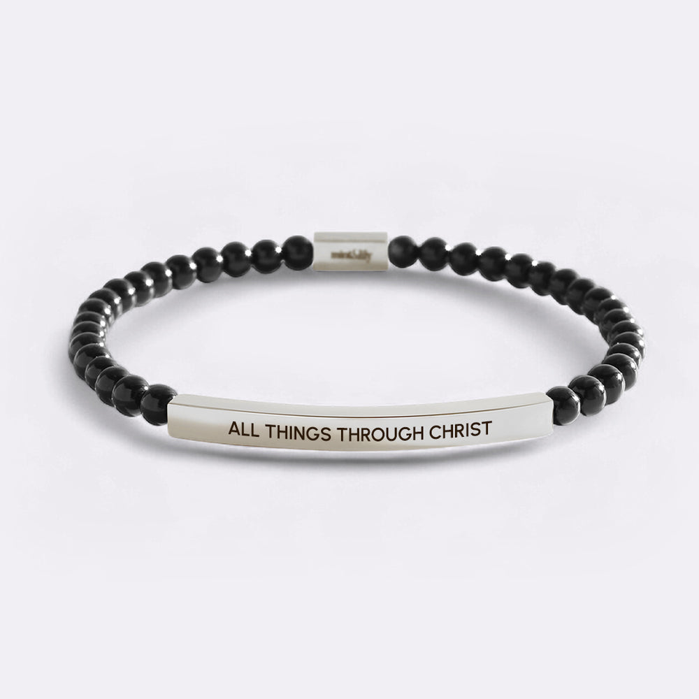 Black beaded bracelet with a silver bar featuring 'All Things Through Christ' on a white background