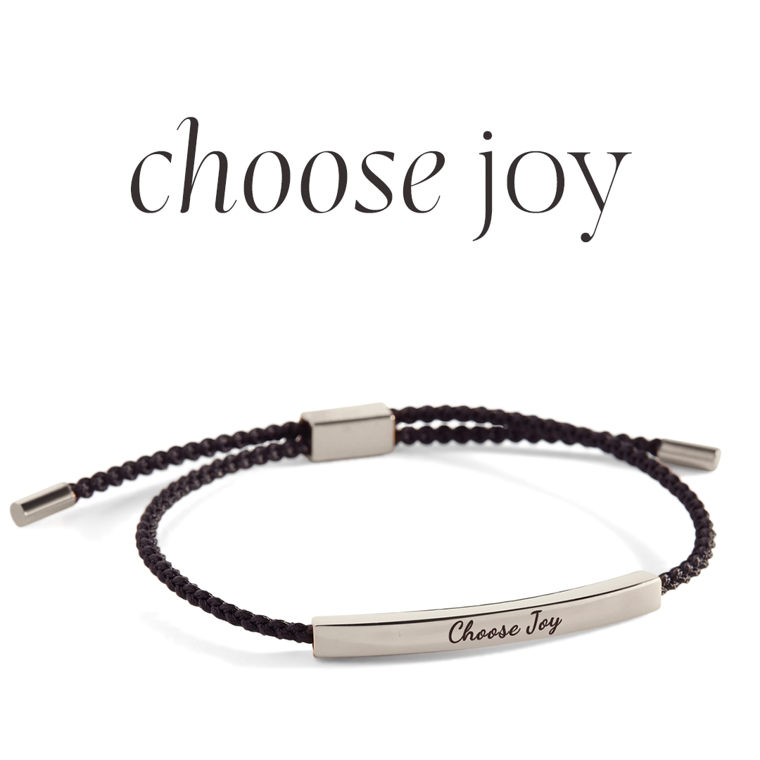 Bracelet with 'Choose Joy' engraving on a light background