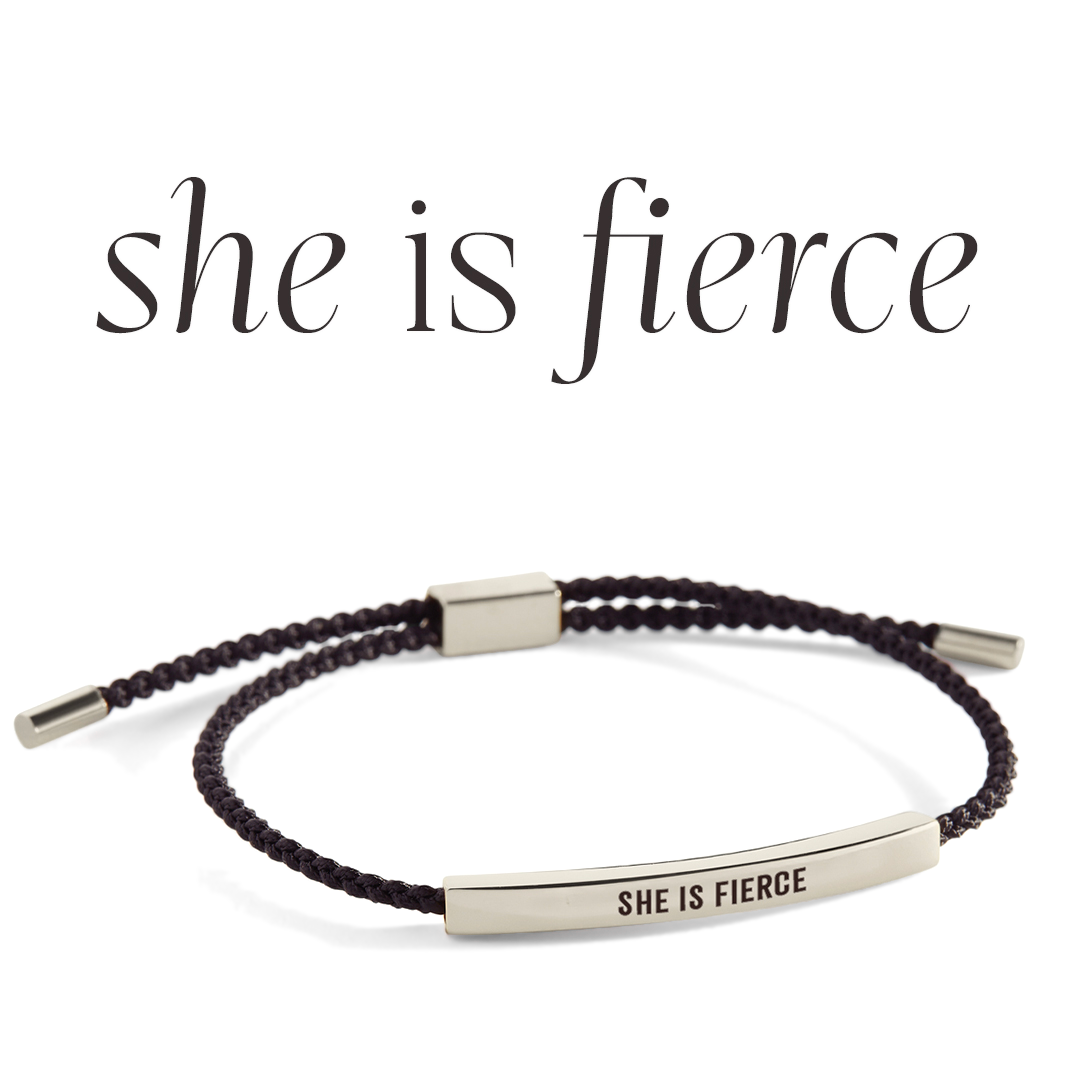 Bracelet with 'SHE IS FIERCE' engraving on a light background