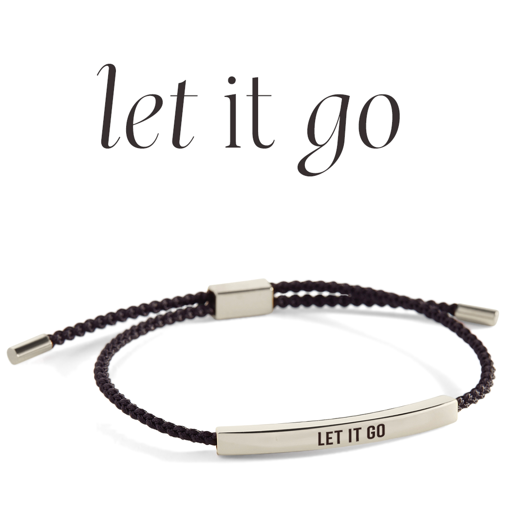 Bracelet with 'LET IT GO' engraving on a light background