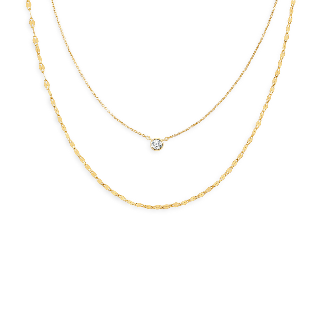 Two gold necklaces on a white background