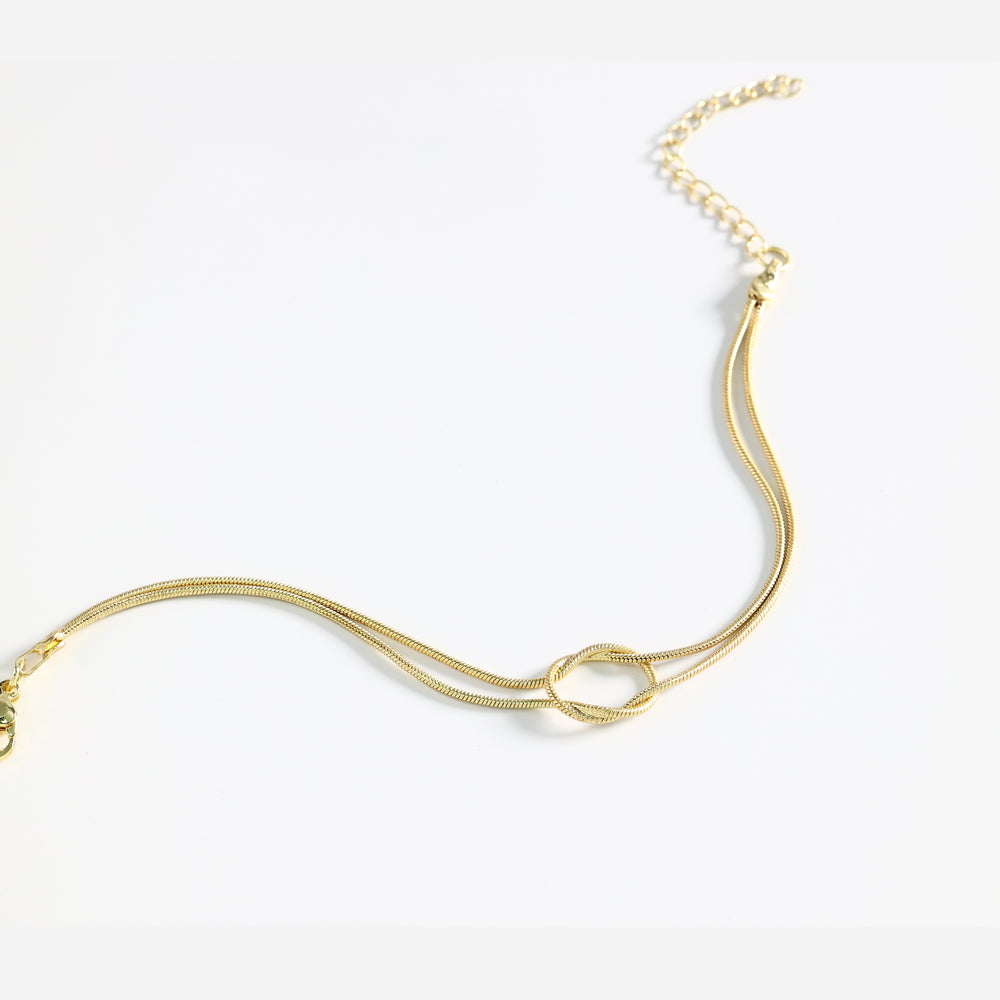 Gold necklace on a white background