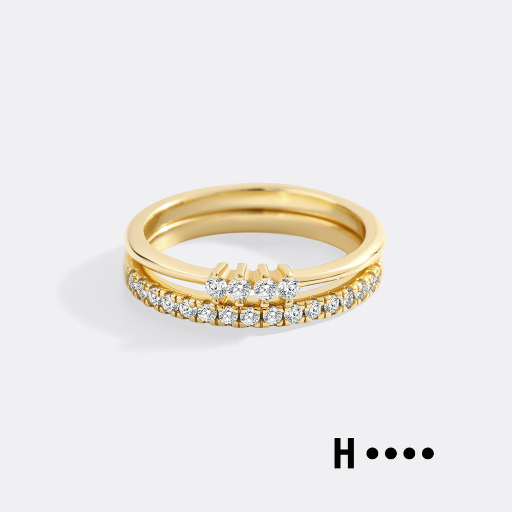 Gold ring with diamonds on a white background
