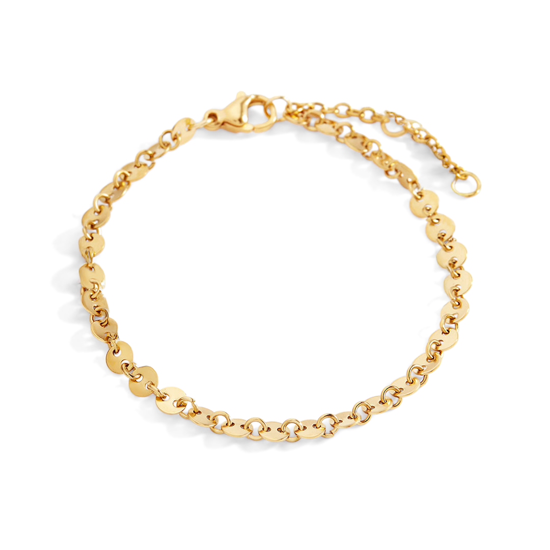 Gold chain bracelet on a light gray background