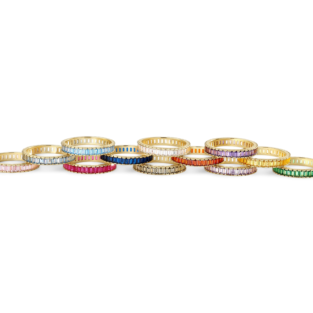 Colorful rings arranged in a line on a white background