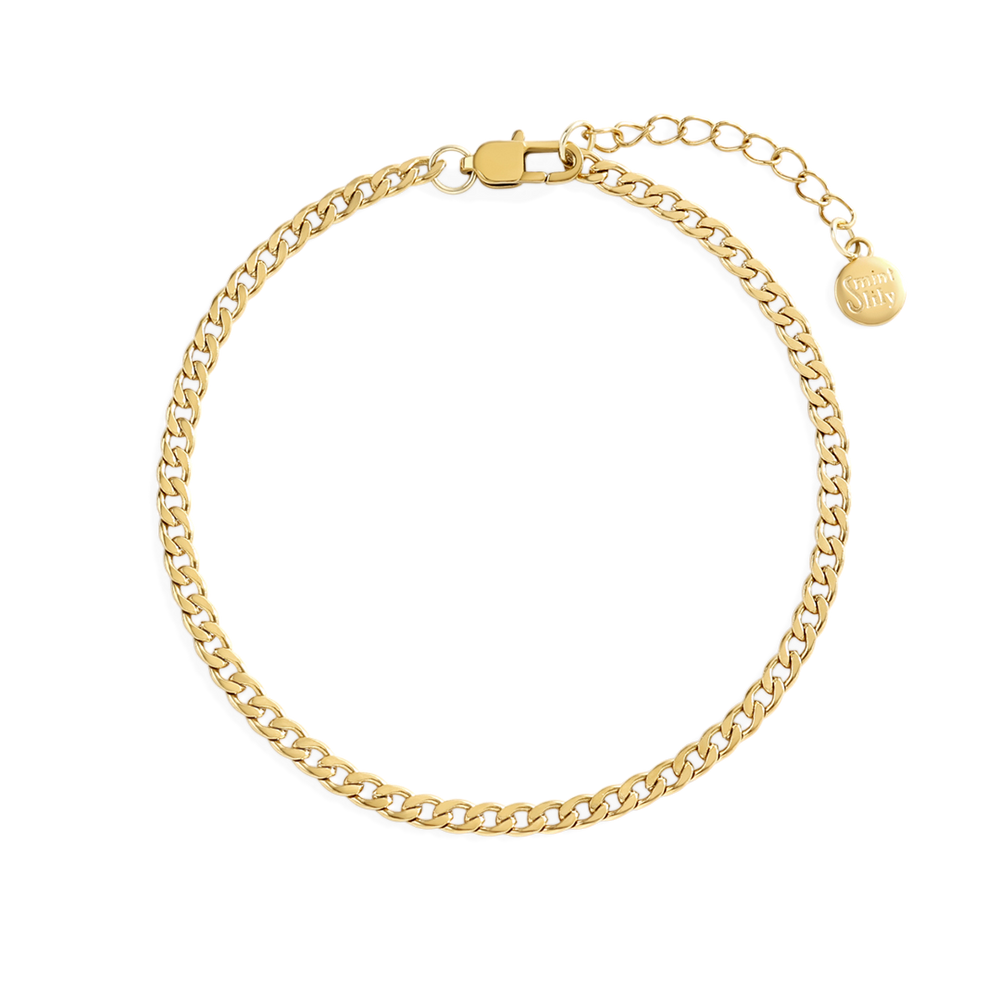 Gold chain bracelet on a light gray background
