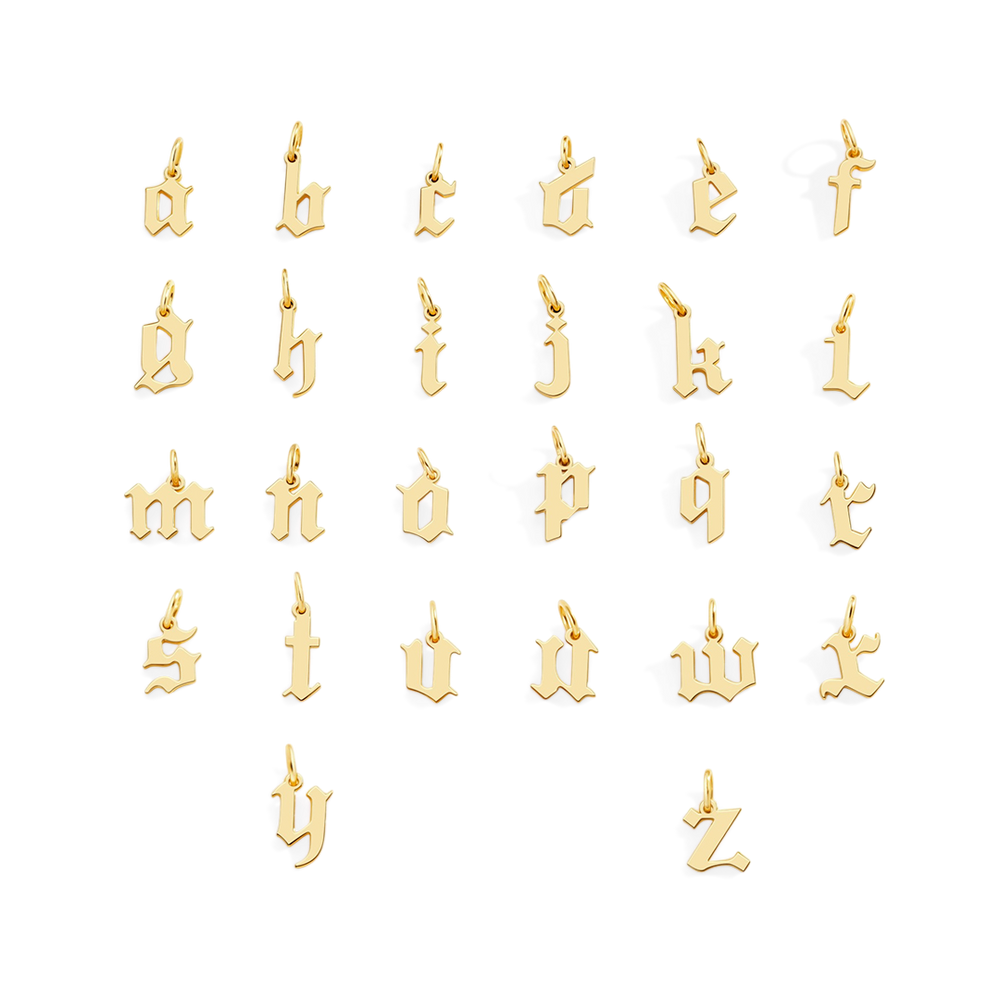 Gold alphabet letter pendants on a white background