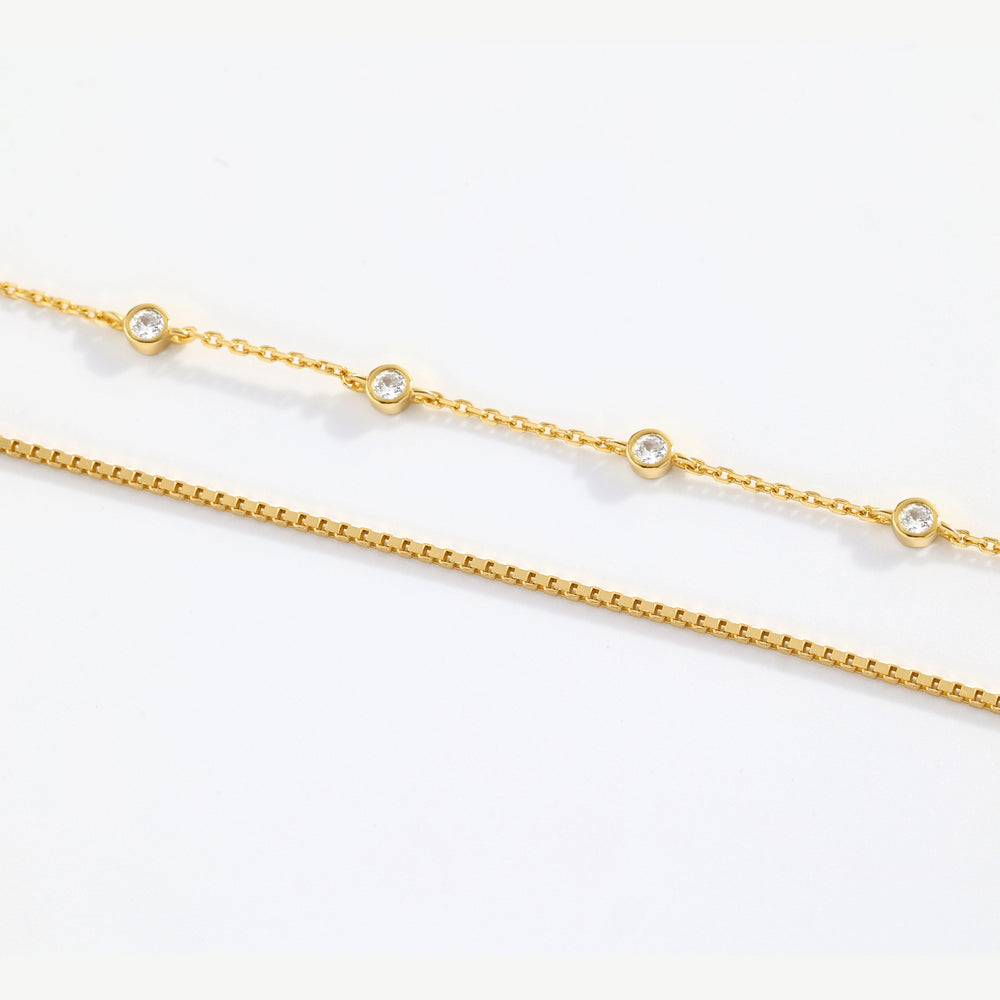Gold chain necklace on a white background