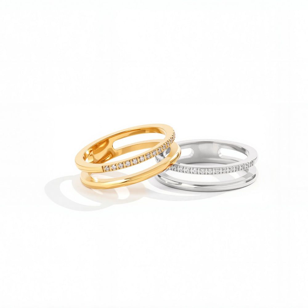 Gold and silver stainless steel double-band pave rings displayed side by side on a white background