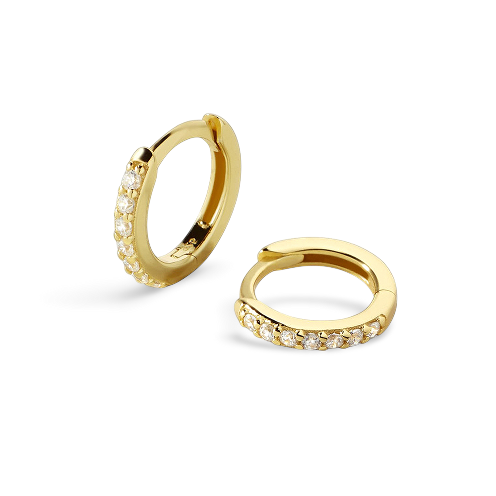 Gold hoop earrings with small diamonds on a light gray background