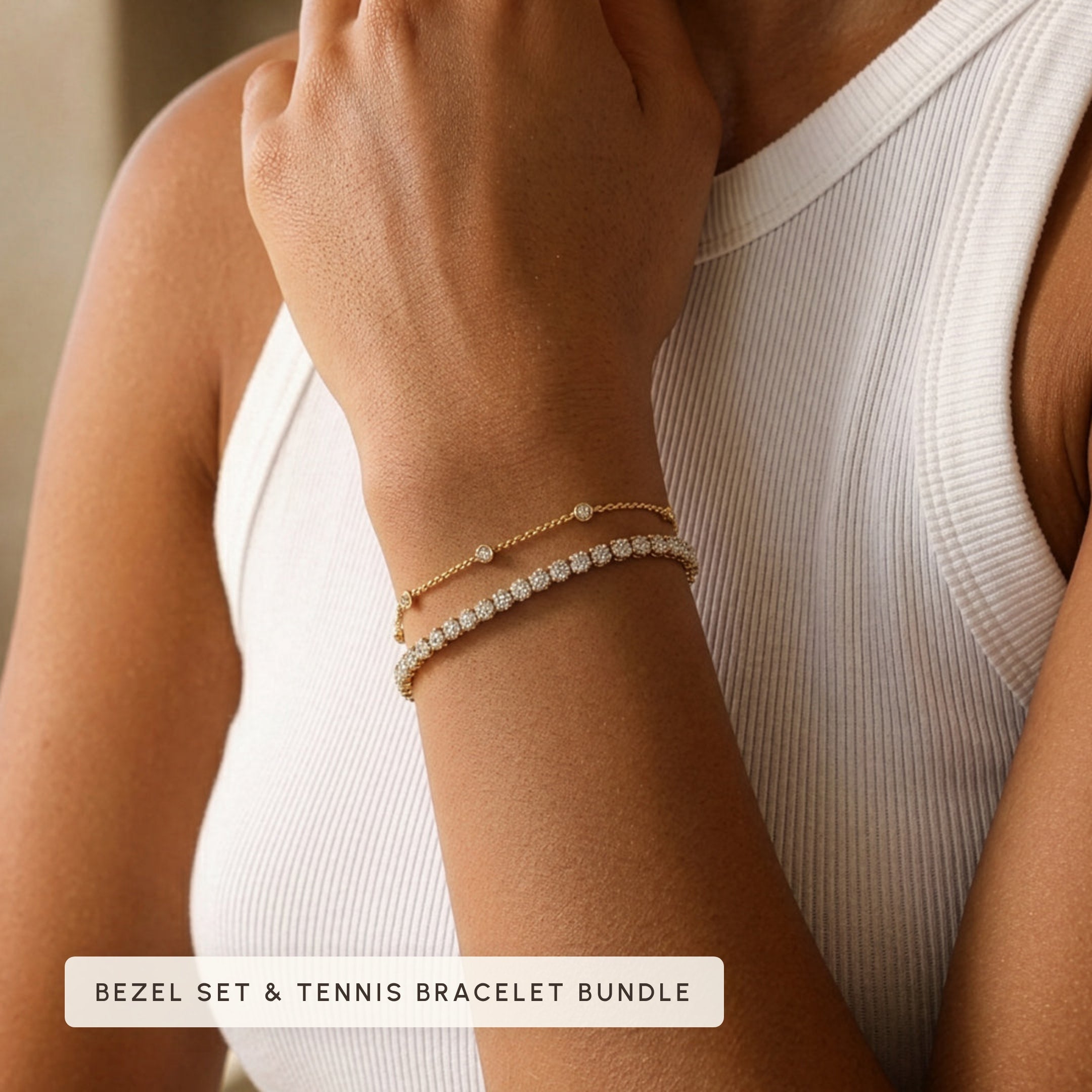 Bezel set bracelet and tennis bracelet bundle worn on model's wrist