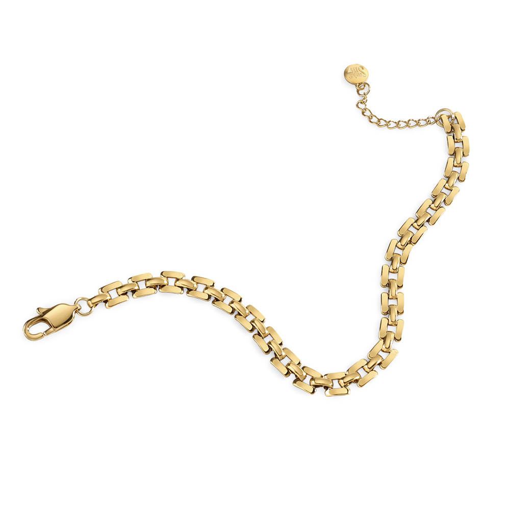 Gold chain bracelet on a light gray background