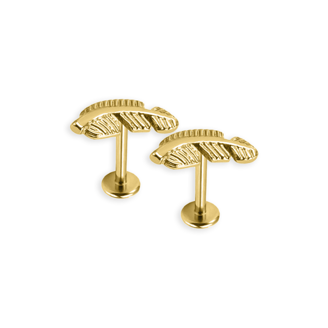 A single gold-colored labret stud with a bee design on a post.